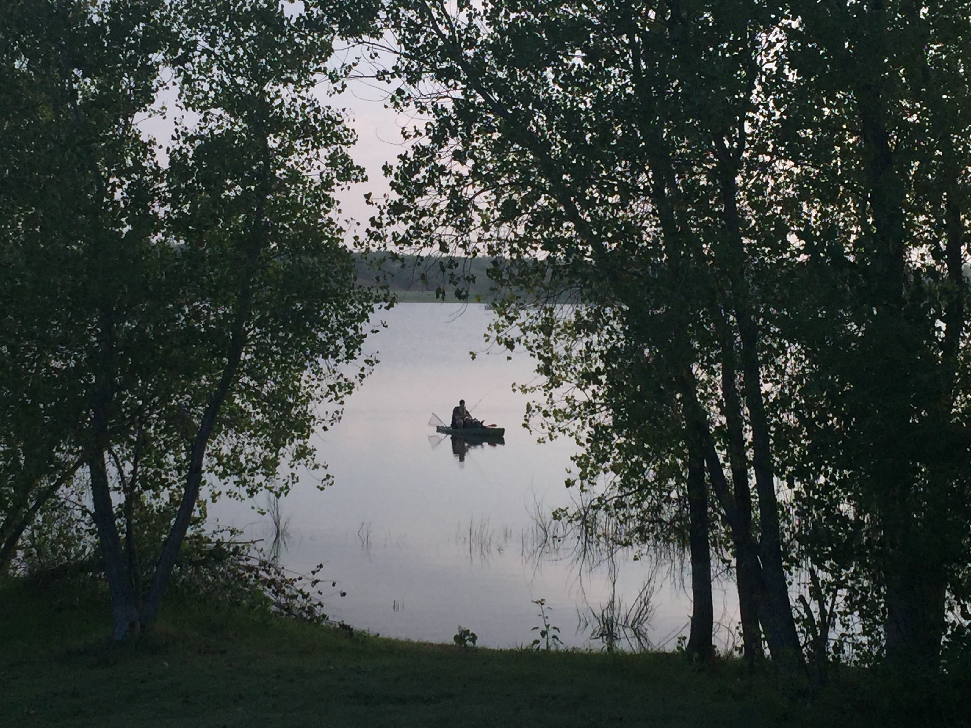 I looked up from my Bible to this sweet sight - my boy on the lake, early morning, fishing in his kayak that he saved and bought off Craigslist. 